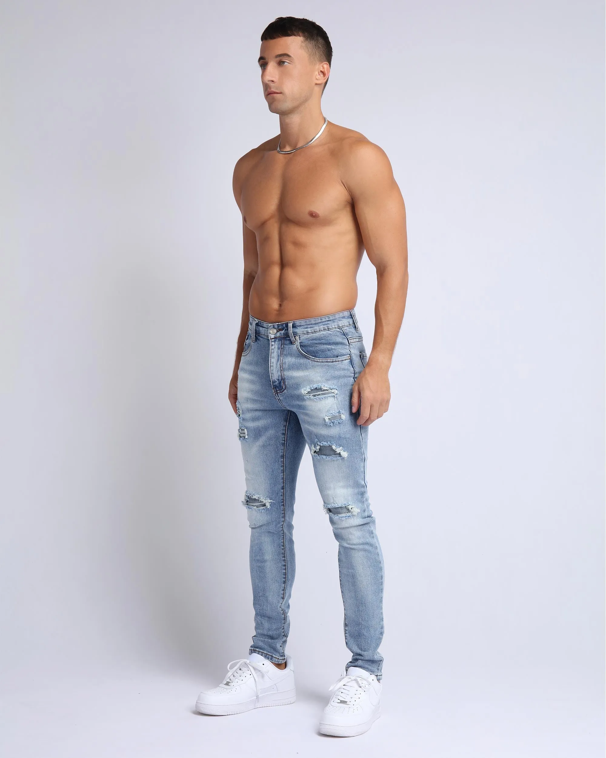 Light Wash Slim Fit Ripped Blue Jeans